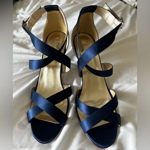 Blue satin strapped heels.